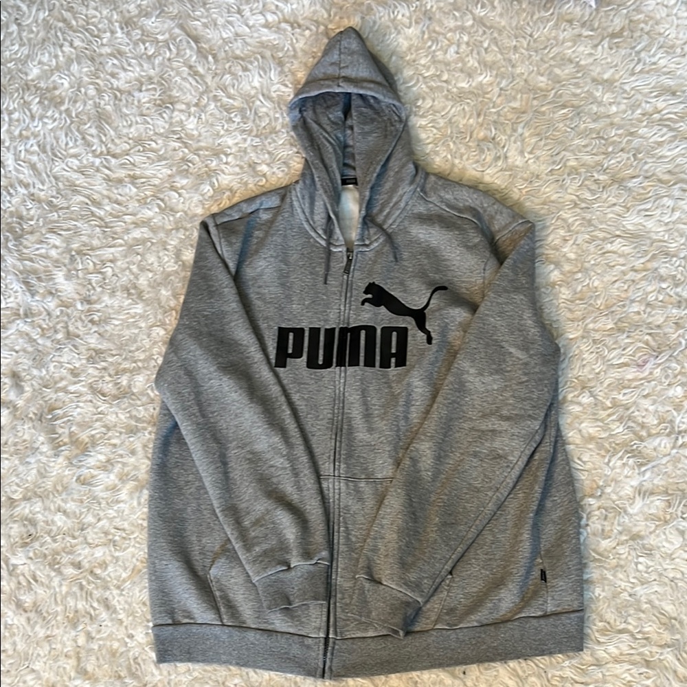 Grey men’s puma zip up jacket.